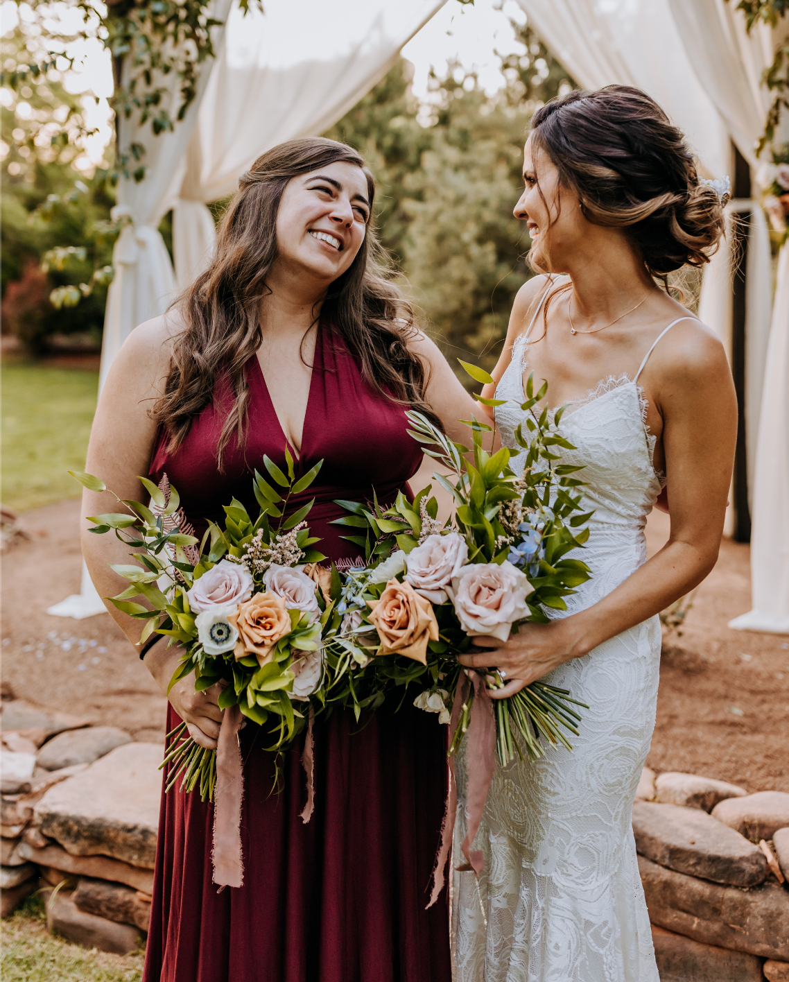 Bride and bridesmaid holding wedding bouquets at a Sedona wedding