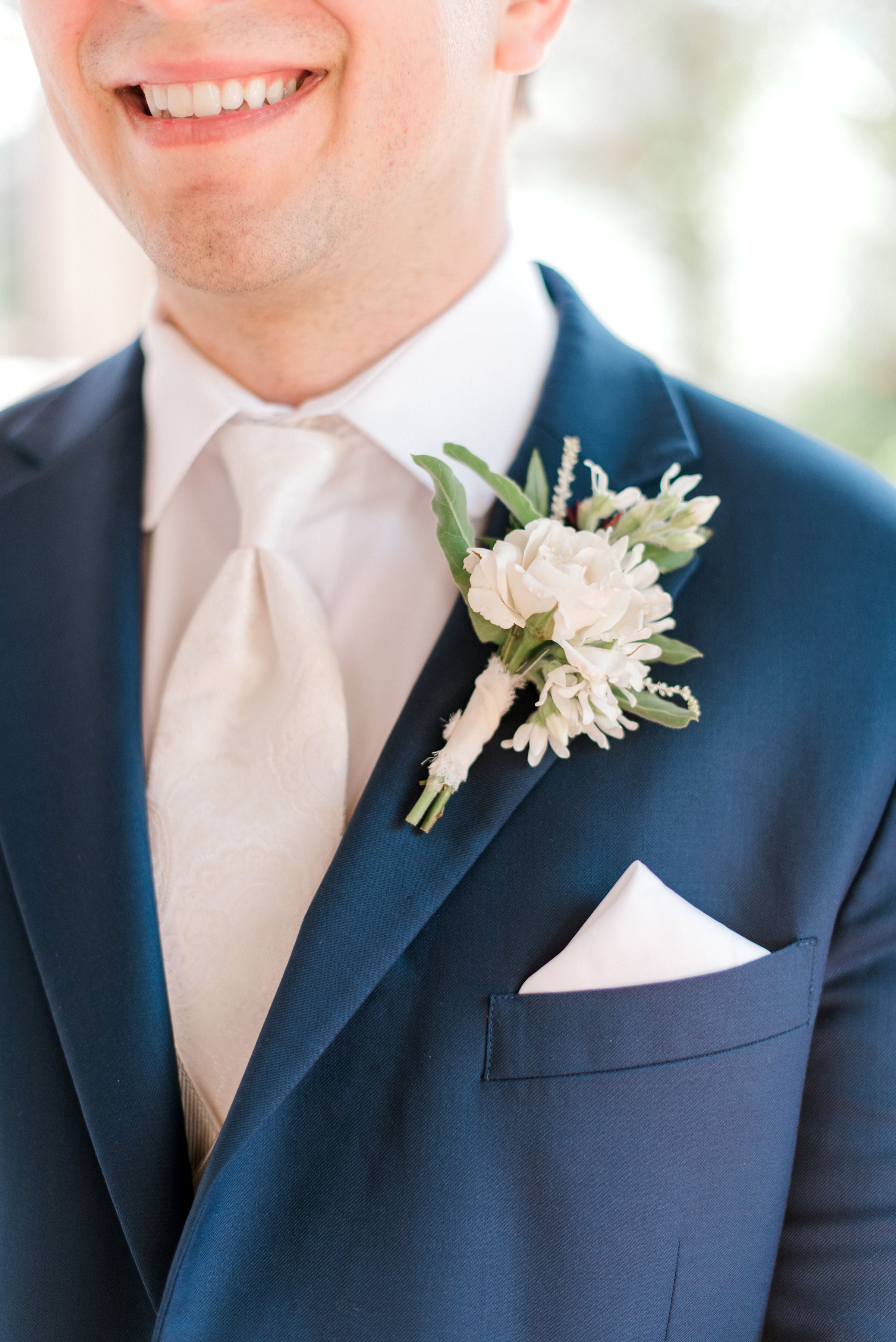 boutonniere on a navy suit