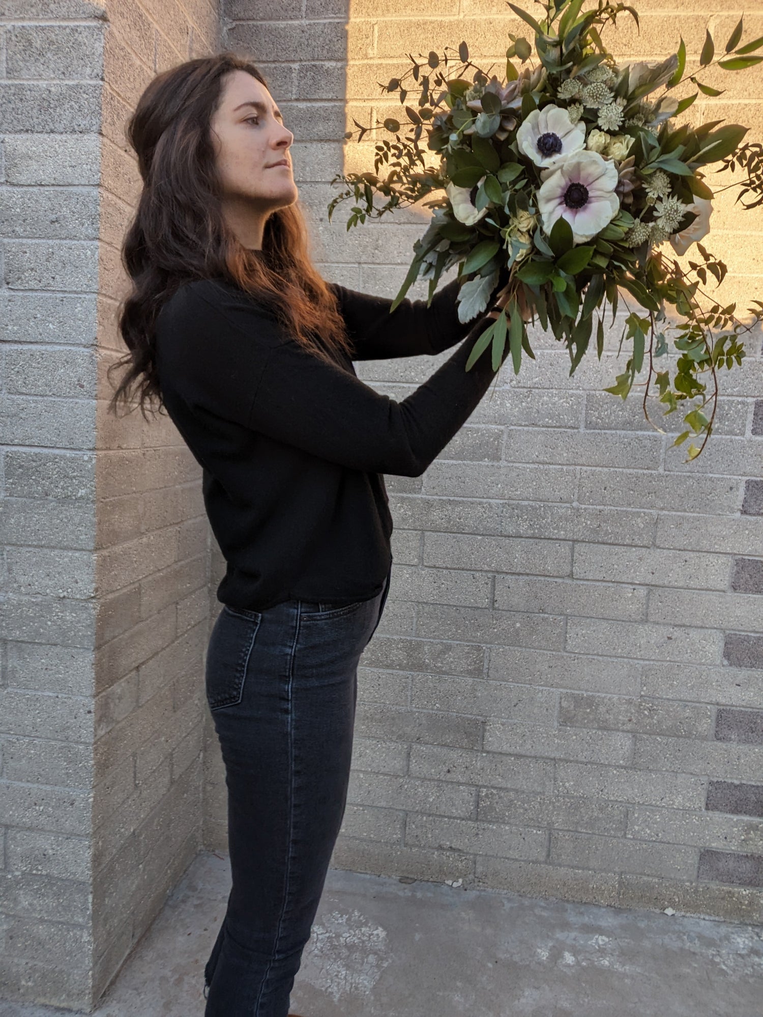 A florist examines her bouquet